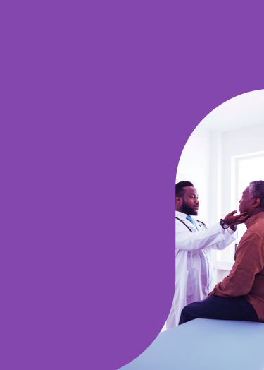 Male doctor performs physical examination, lifting the male patient's chin.