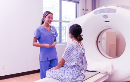 Smiling healthcare provider speaks with her patient