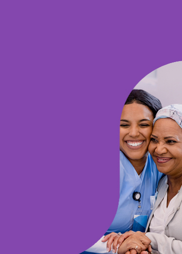 Nurse hugging cancer patient