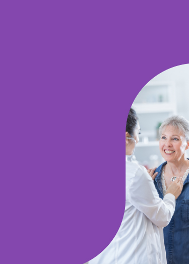 Healthcare provider listens to her patient's heartbeat with a stethoscope