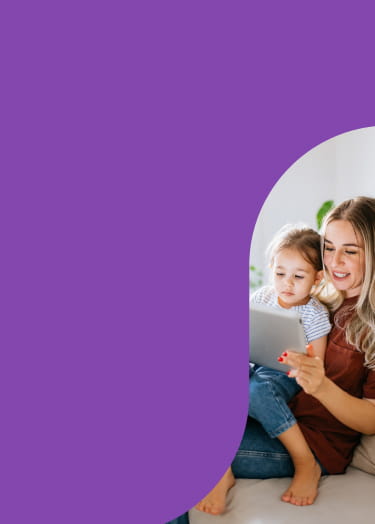 A mom and her child interact with a tablet computer