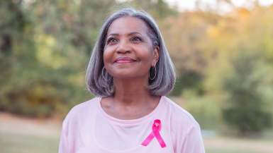 Person wearing pink ribbon