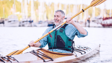 Smiling man in kayak