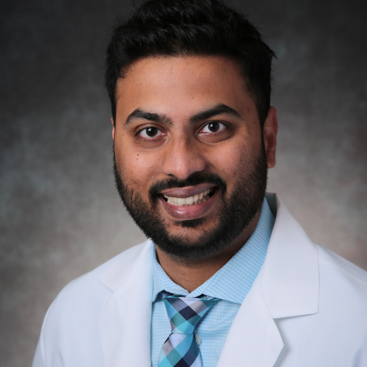 A friendly headshot of Abhishek Singh, MD