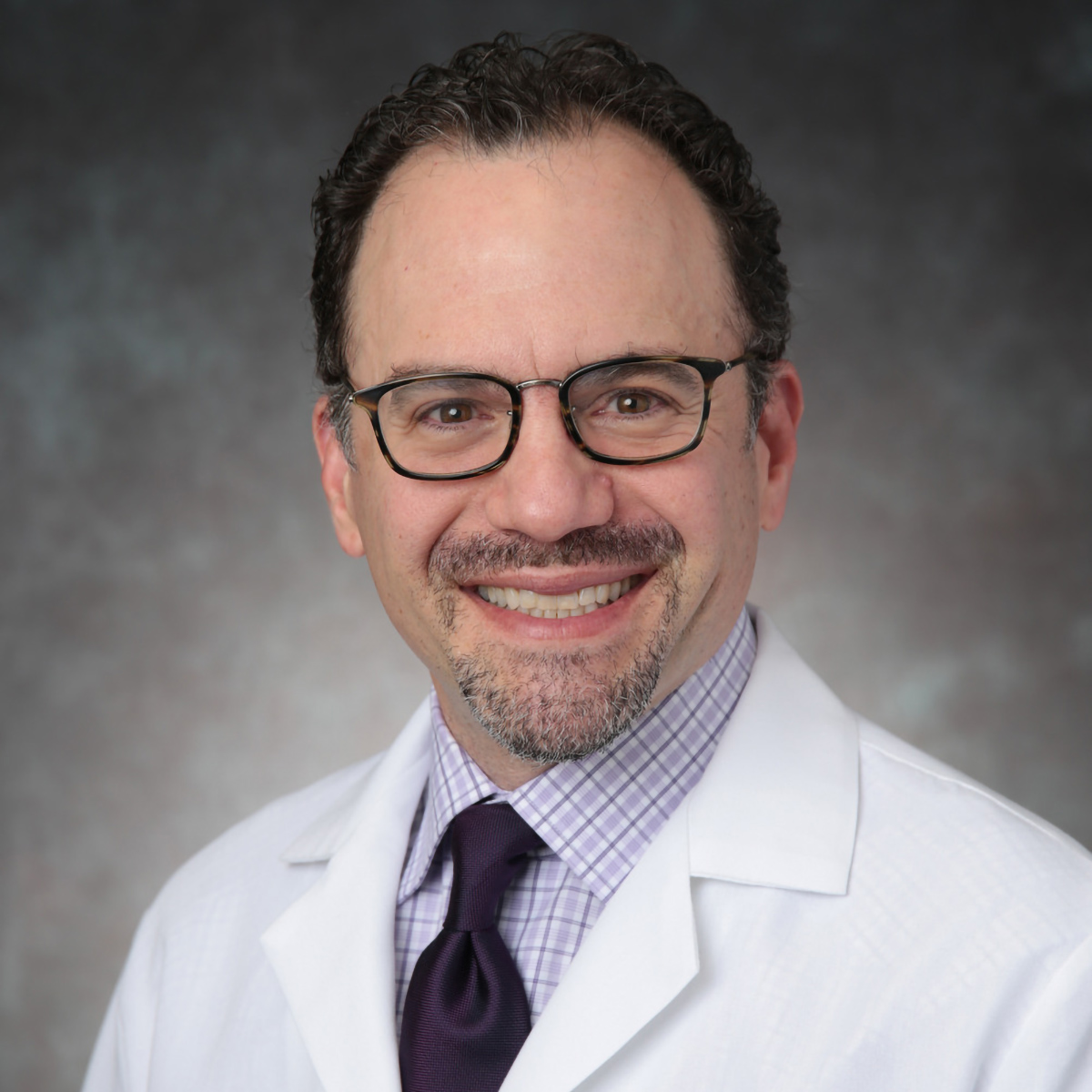 A friendly headshot of Adam Lourie, MD