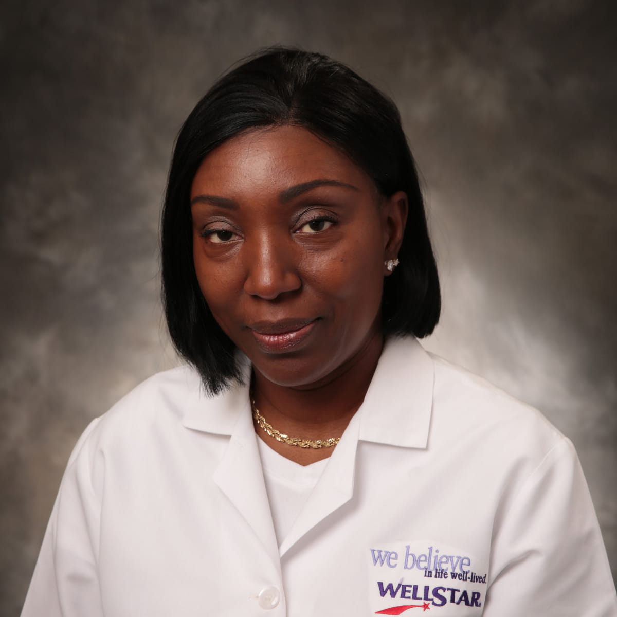 A friendly headshot of Adanna Nwachukwu, MD