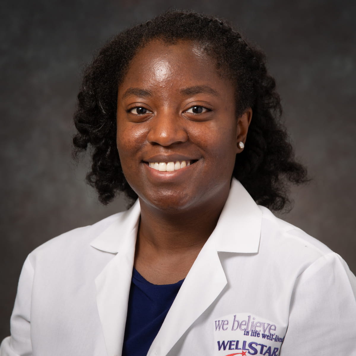 A friendly headshot of Afua Akhi-Gbade, MD