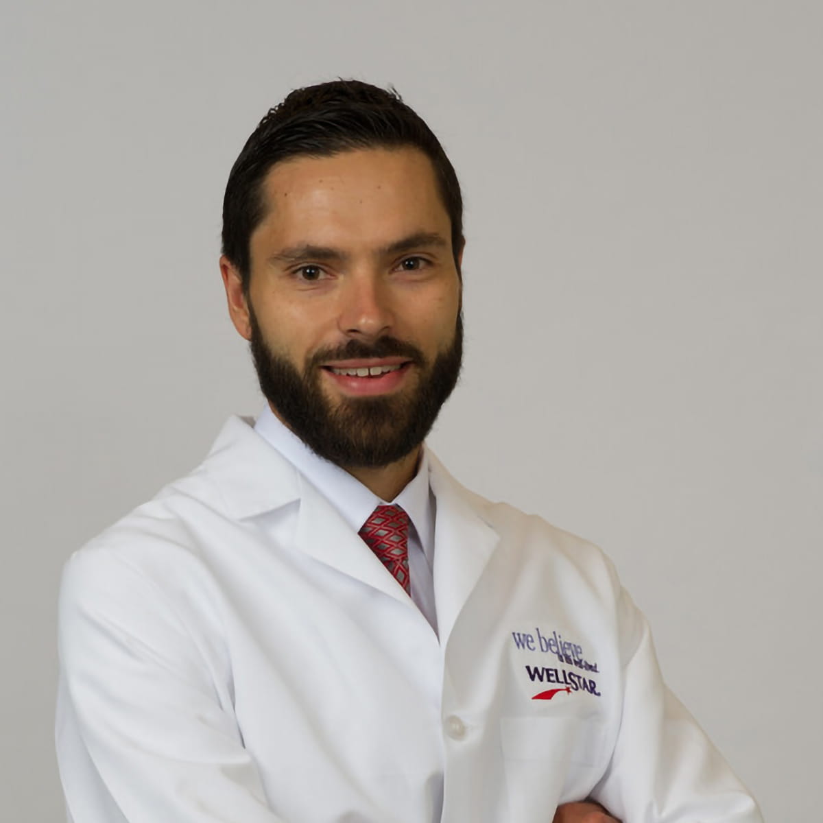 A friendly headshot of Alexander Liaugminas, MD