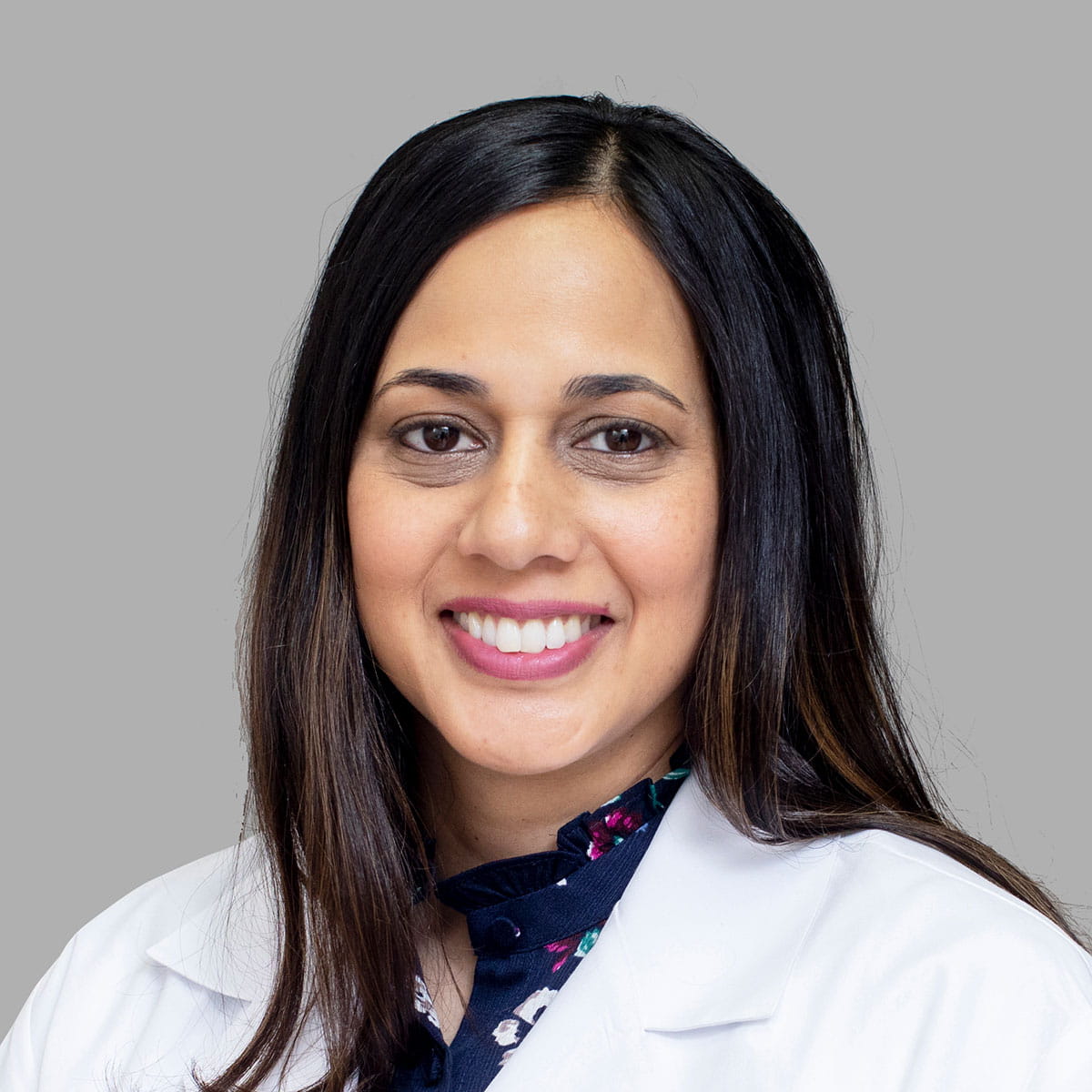 A friendly headshot of Dr. Aliya Zia