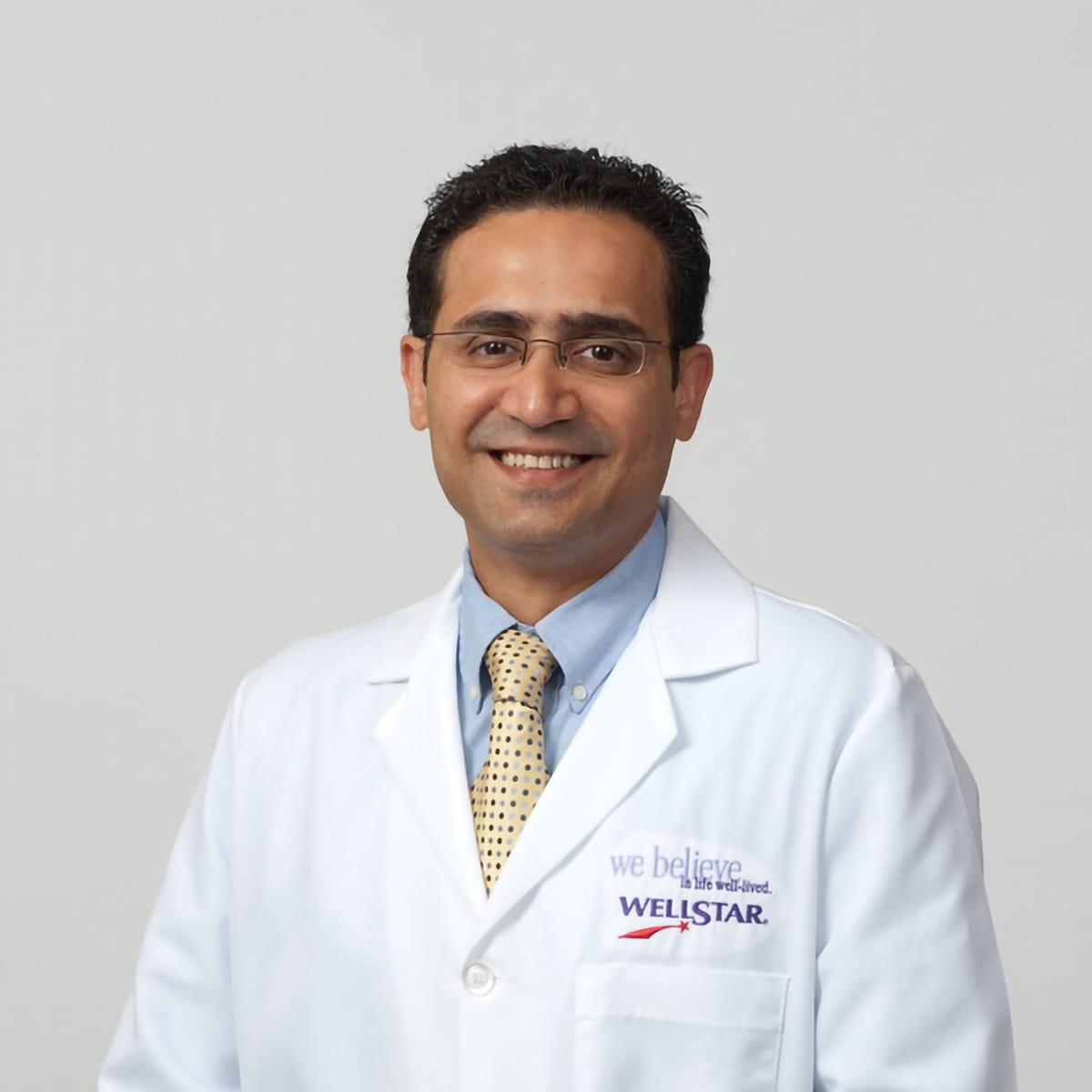 A friendly headshot of Amyn Hirani, MD