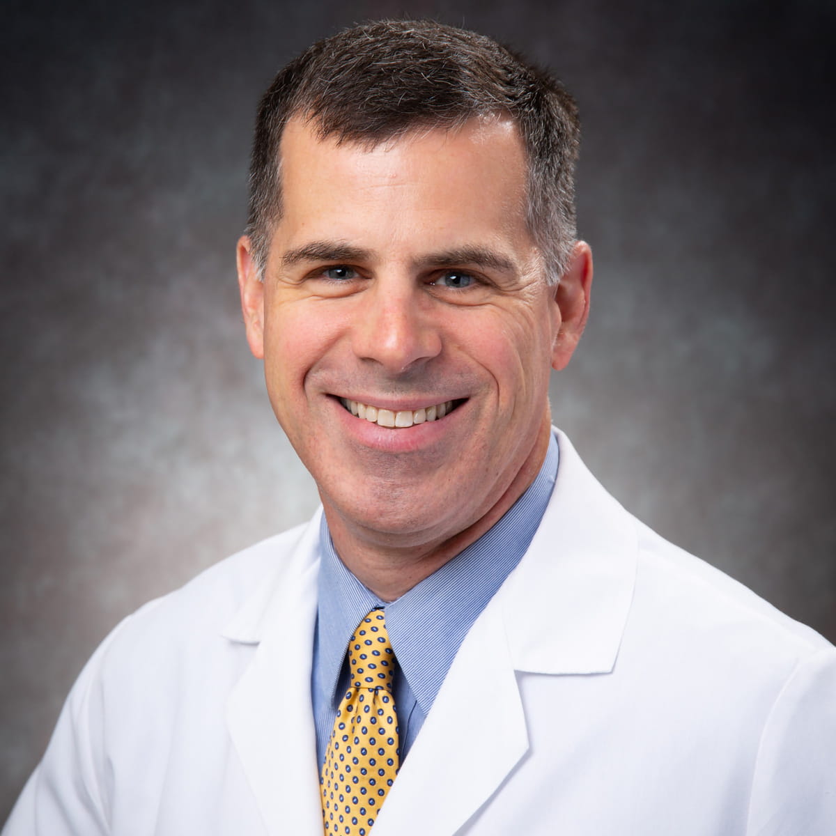 A friendly headshot of Andrew Doyle, MD