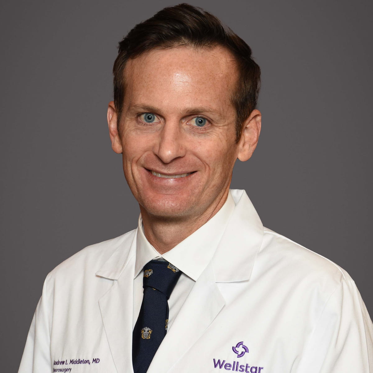 A friendly headshot of Andrew Middleton, MD