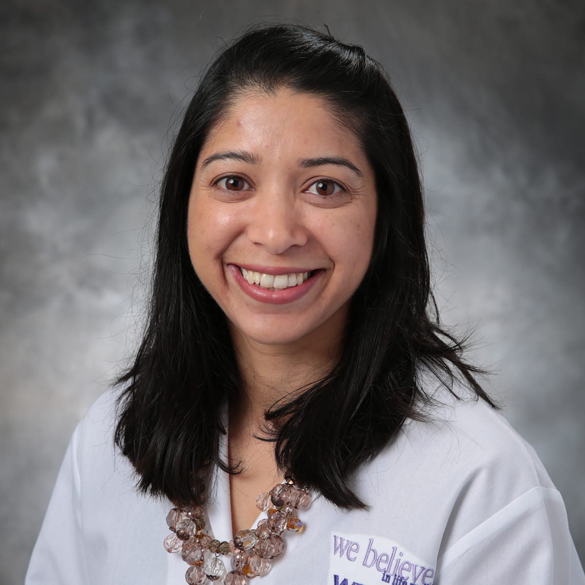 A friendly headshot of Anjali Grandhige, MD