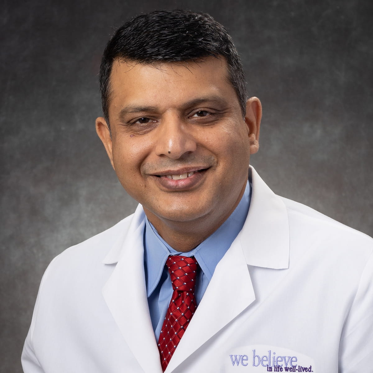 A friendly headshot of Asif Tahir, MD