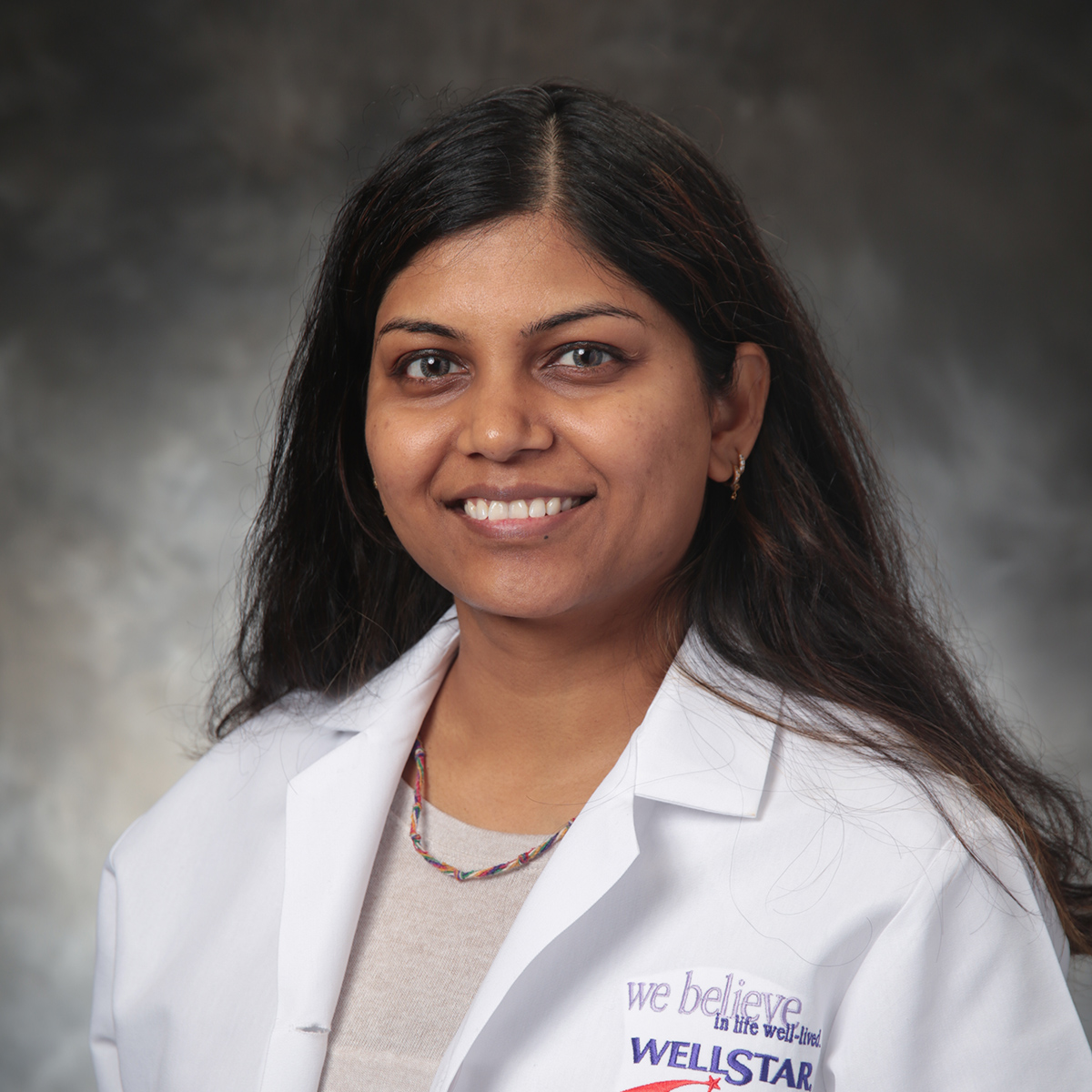 A friendly headshot of Bhavi Purohit, MD