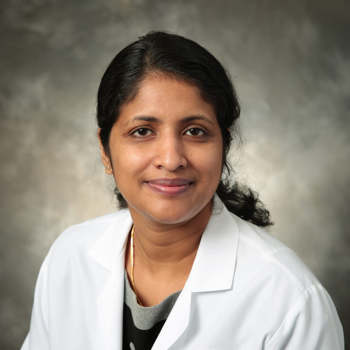 A friendly headshot of Bini Mathew, MD