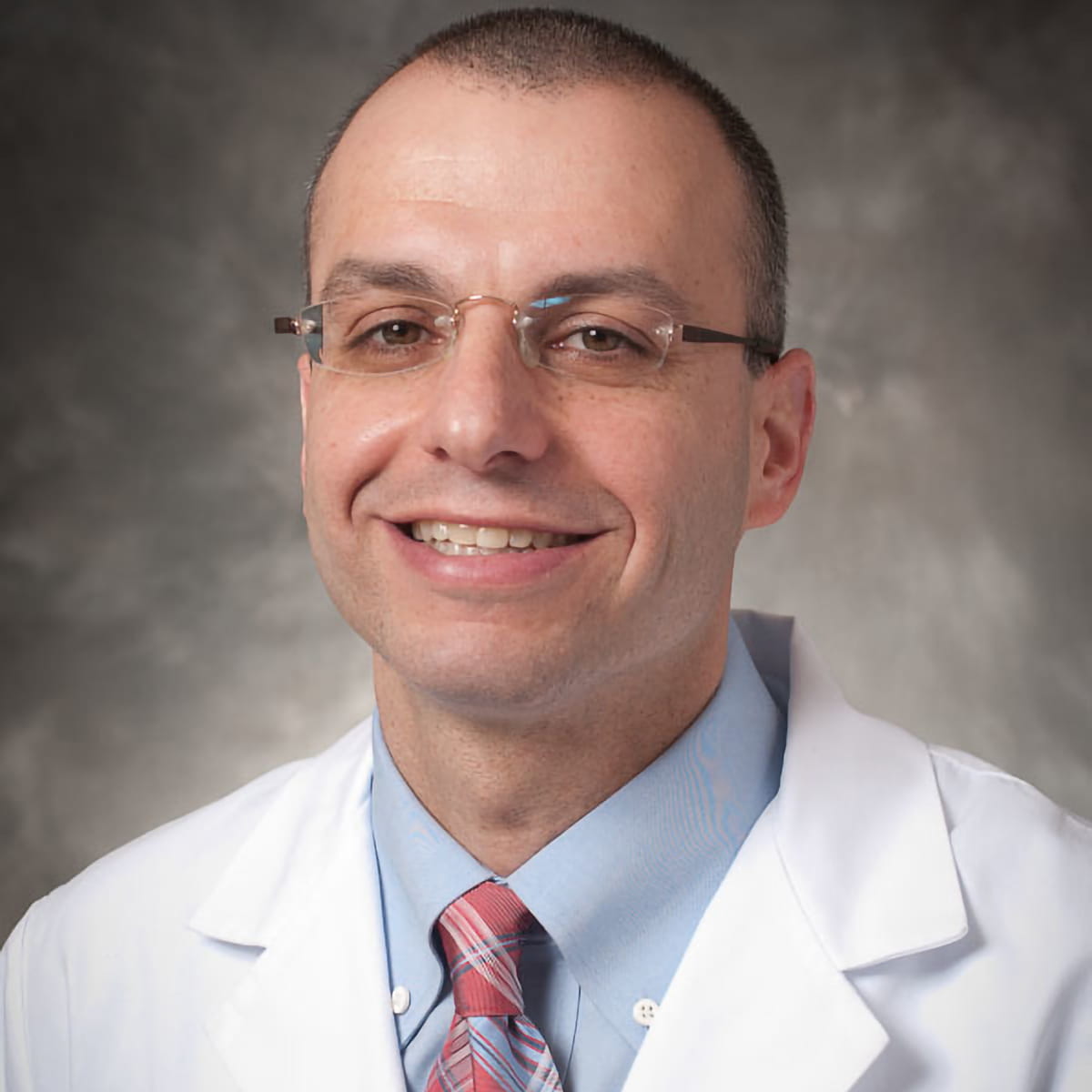 A friendly headshot of Bruce Alayof, MD