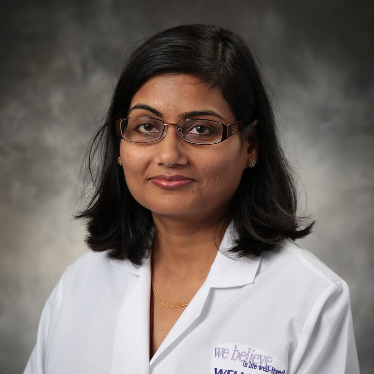 A friendly headshot of Charu Prakash, MD