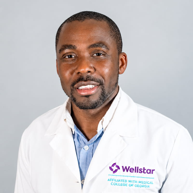 A friendly headshot of Chris Sossou, MD