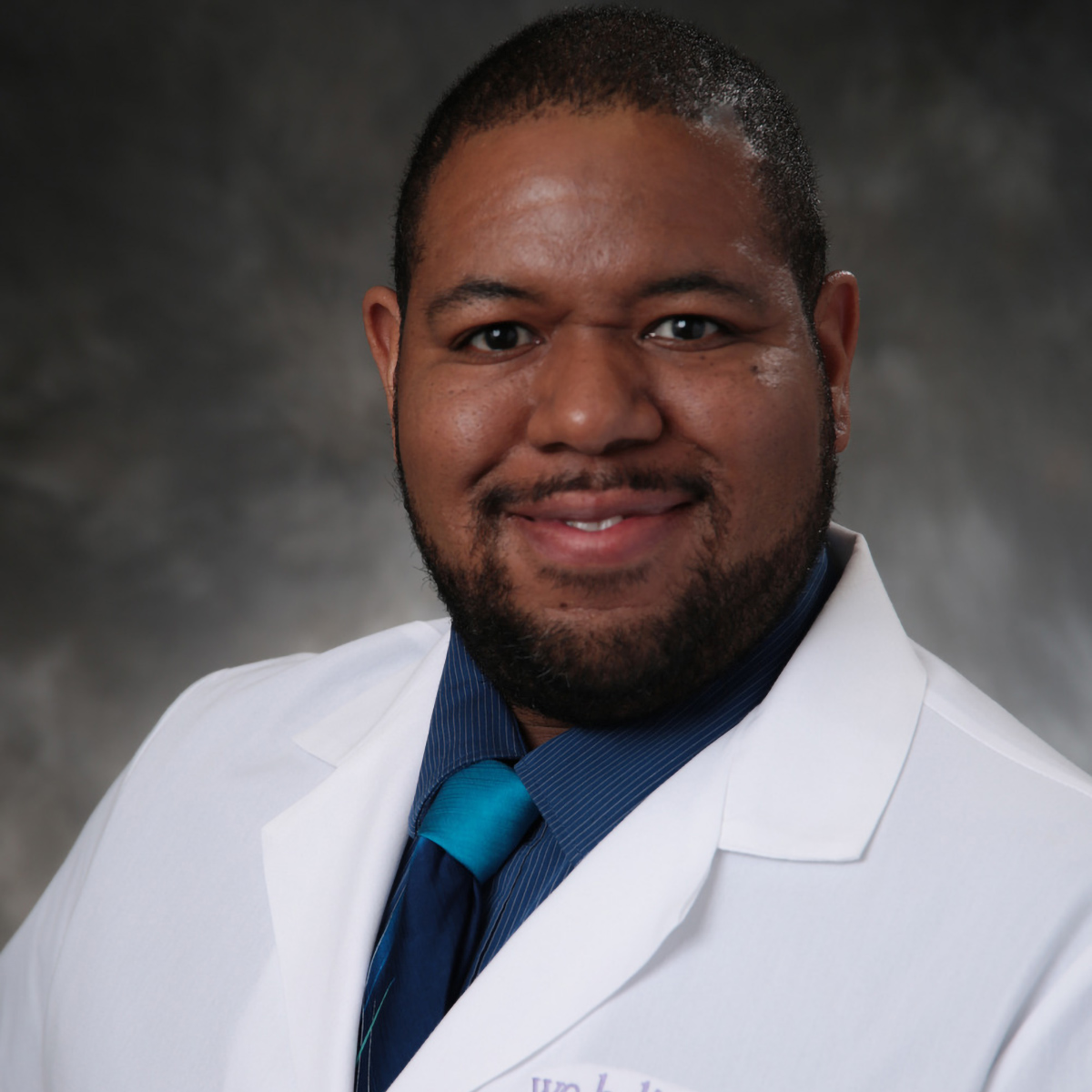 A friendly headshot of Christian Williams, MD