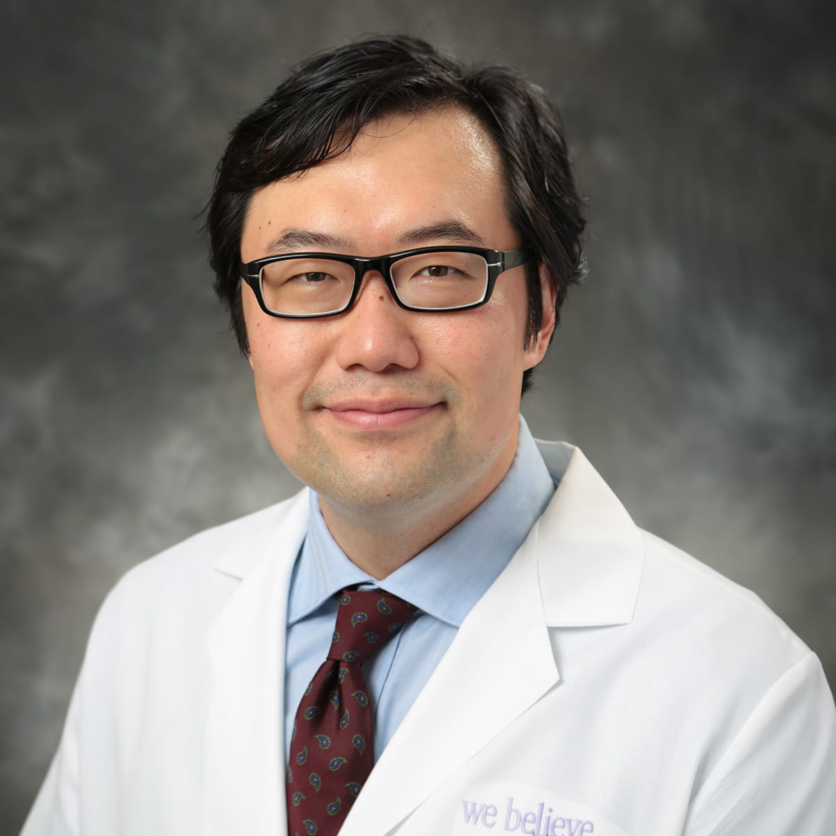 A friendly headshot of David Pae, MD