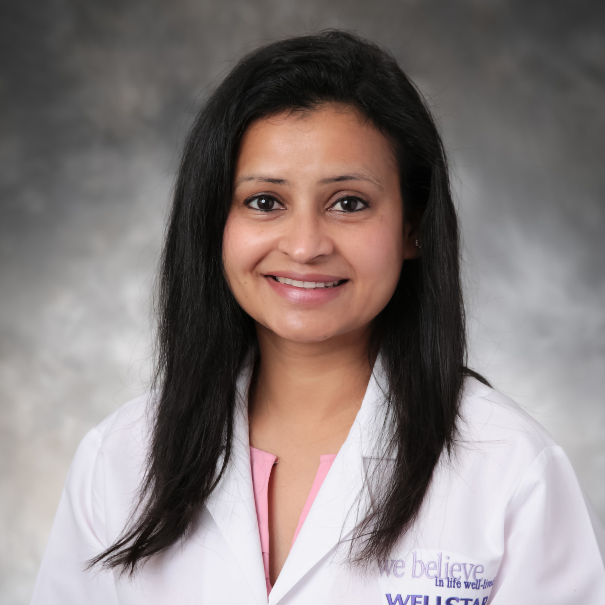 A friendly headshot of Dipika Sharma, MD