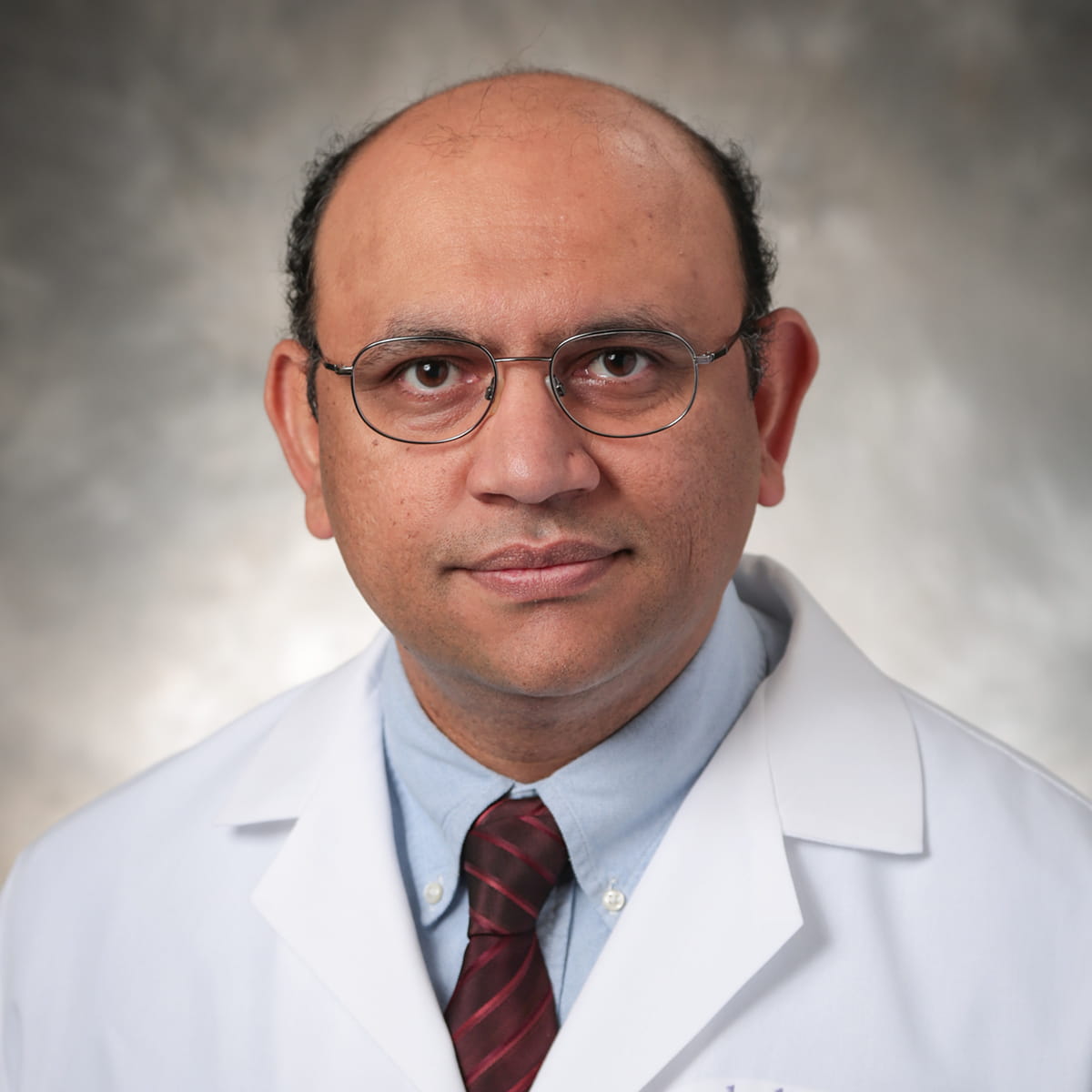 A friendly headshot of Feroz Lalani, MD