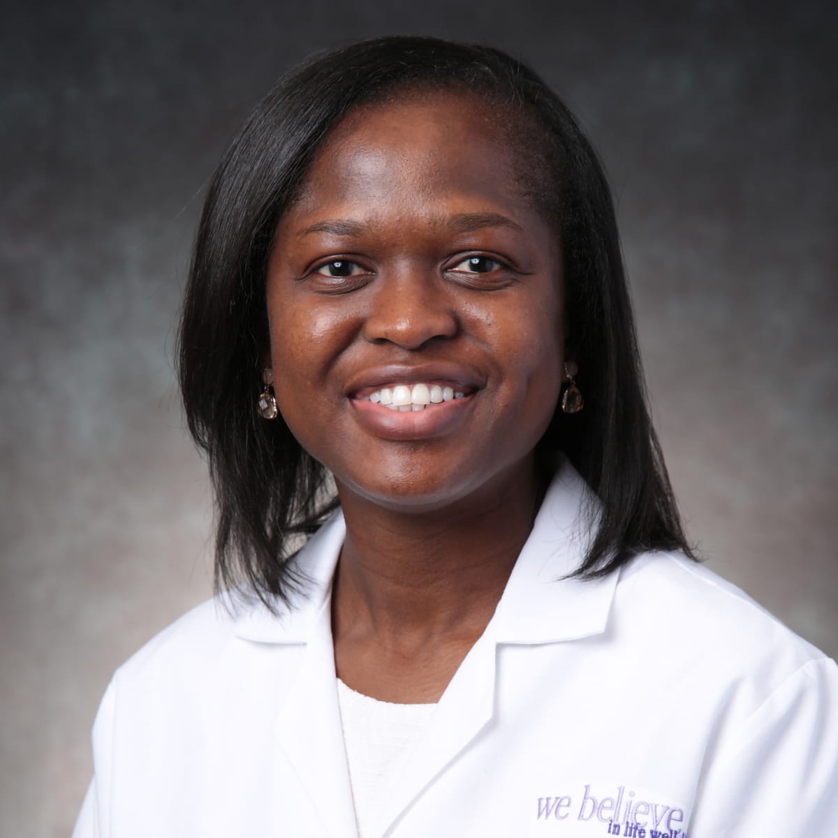 A friendly headshot of Folasade Arinze, MD