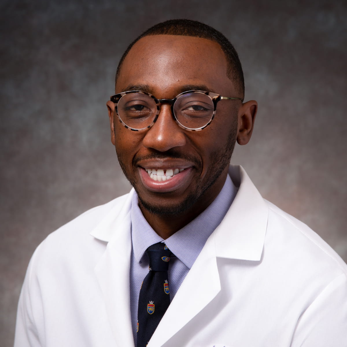 A friendly headshot of Gray Akoegbe, MD