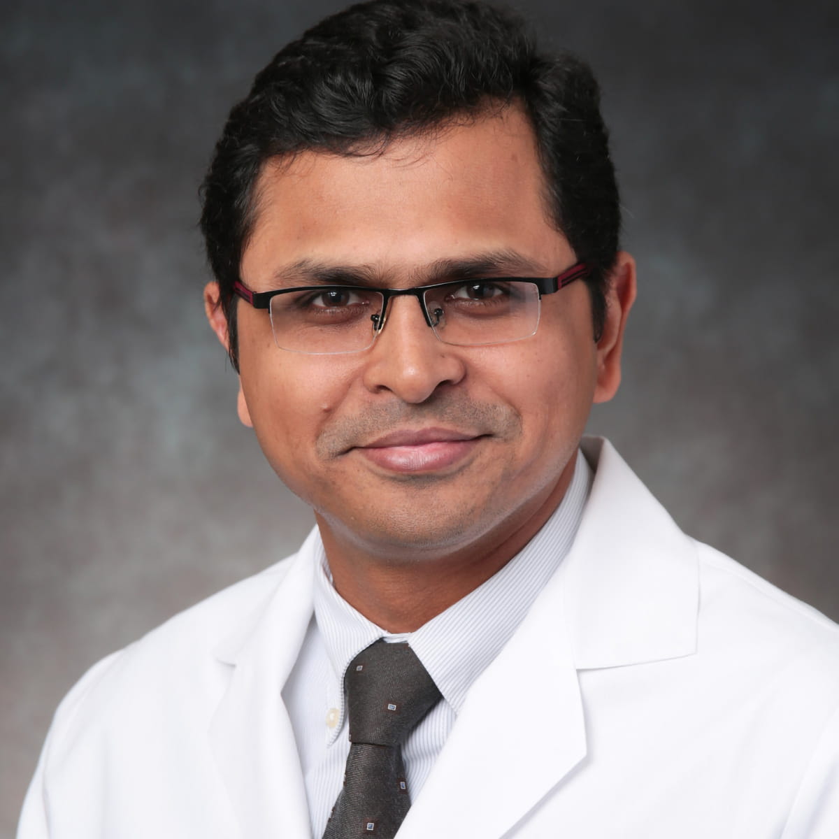 A friendly headshot of Hardikkumar Patel, MD