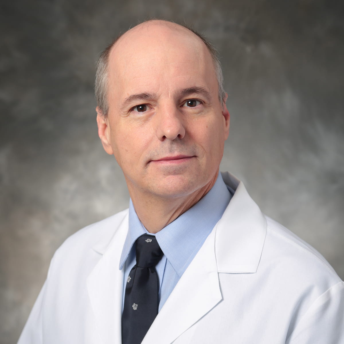 A friendly headshot of James Gilbert, MD