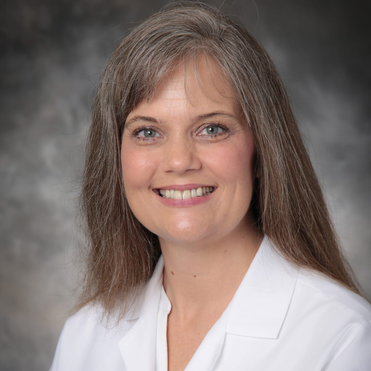 A friendly headshot of Janet Boone, MD