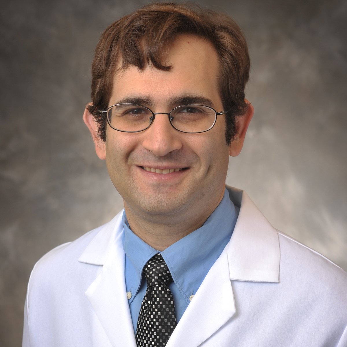 A friendly headshot of Jonathon Herbst, MD