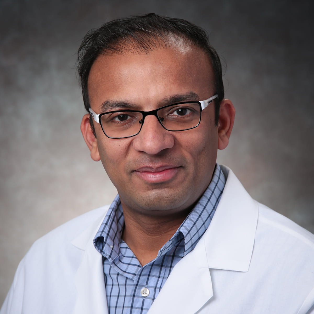 A friendly headshot of Kaushang Gandhi, MD