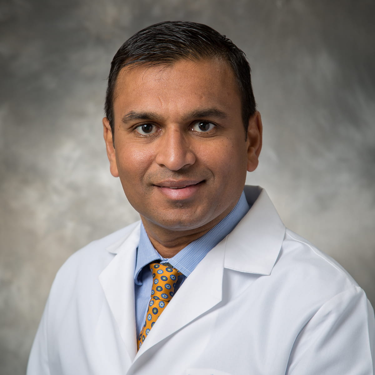 A friendly headshot of Kishor Sadaria, MD