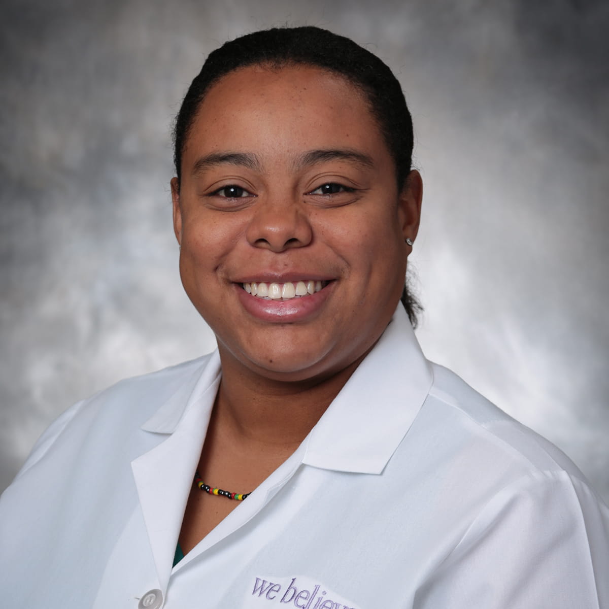 A friendly headshot of Krystina Rowe, MD