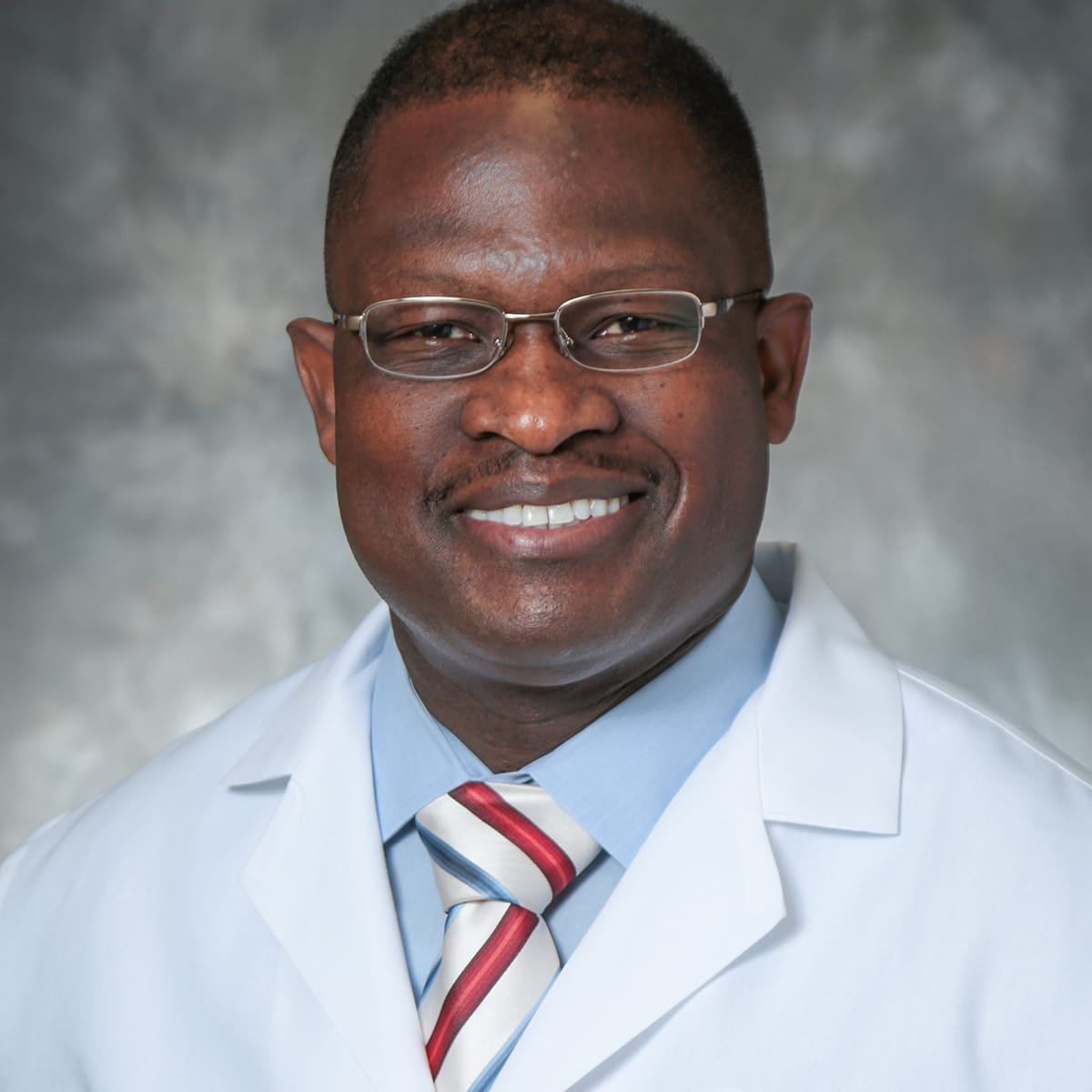 A friendly headshot of Kwasi Karikari, MD