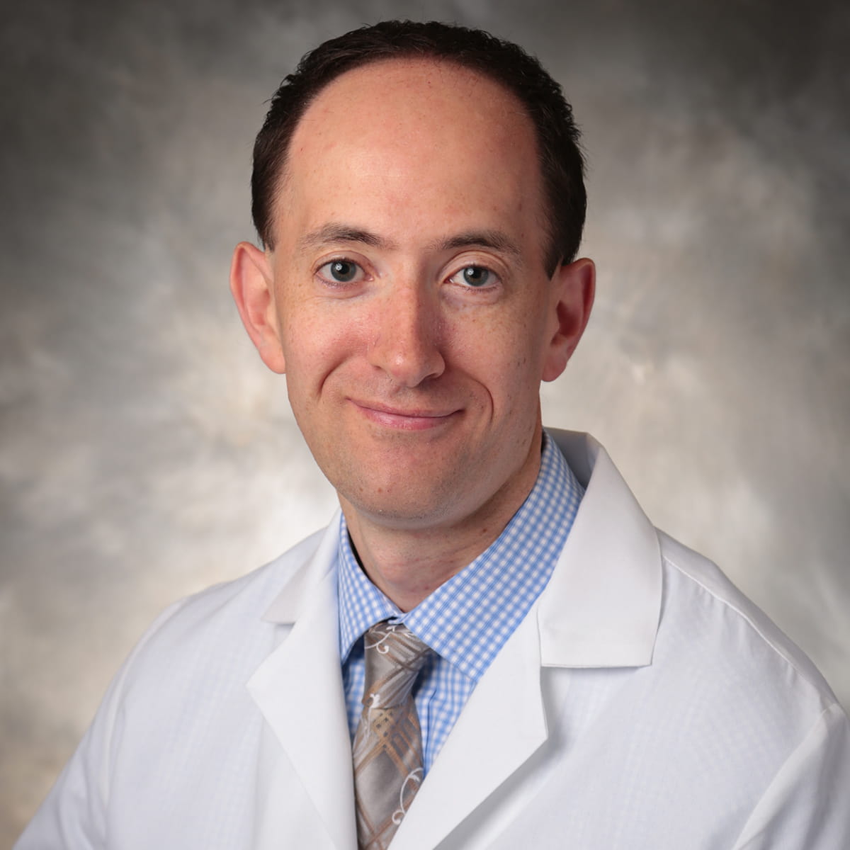 A friendly headshot of Marat Reyzelman, MD