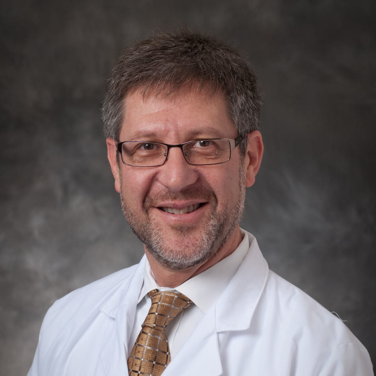 A friendly headshot of Mark Schlosberg, MD