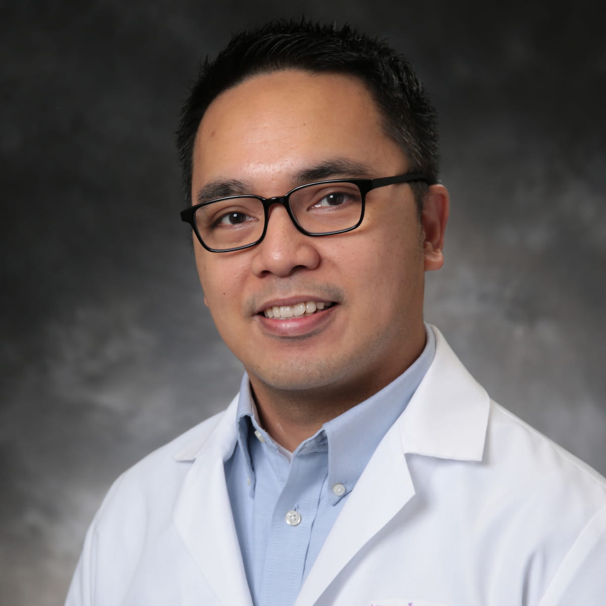 A friendly headshot of Michael Mendoza, MD