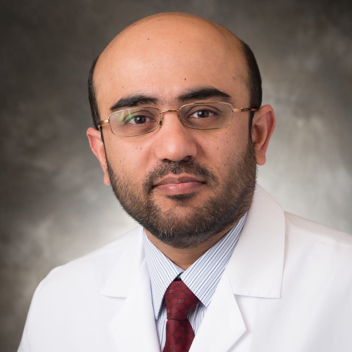 A friendly headshot of Muhammad Pervaiz, MD