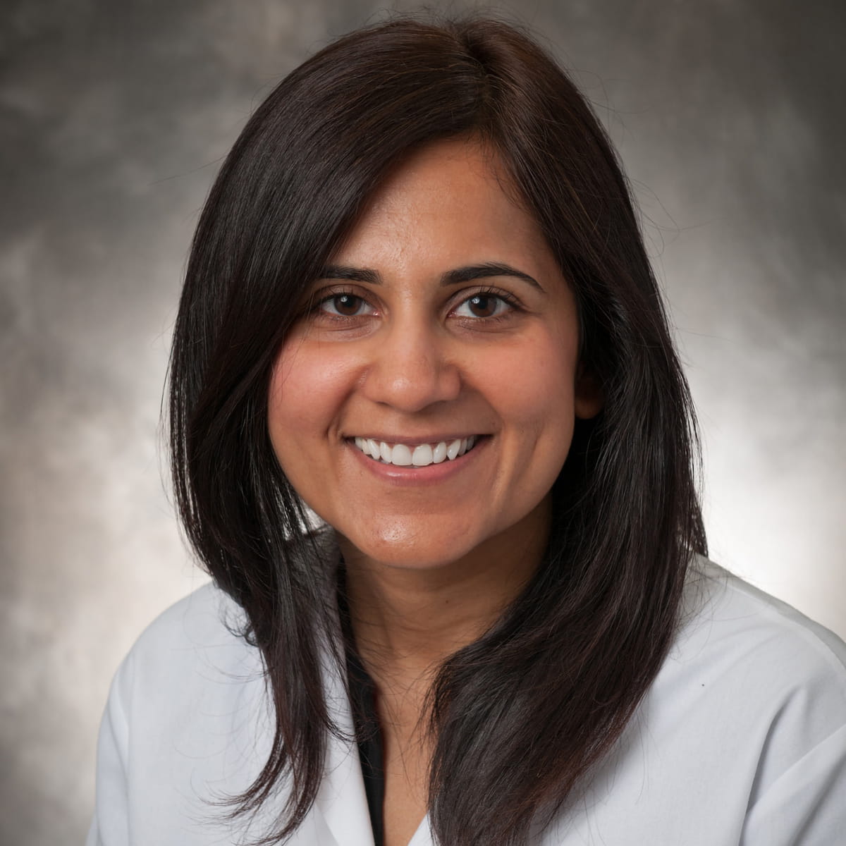 A friendly headshot of Nasira Hussain, MD