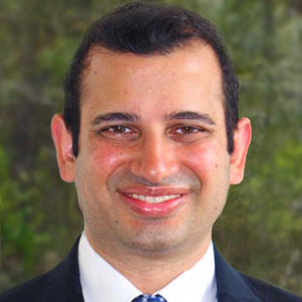 A friendly headshot of Naveen Raj, DO
