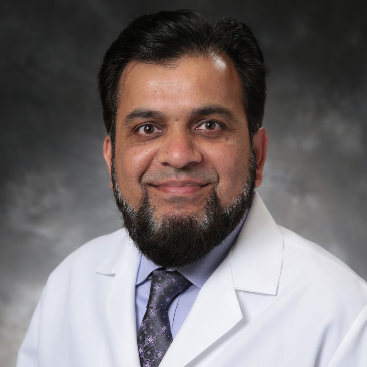 A friendly headshot of Nazim Syed, MD