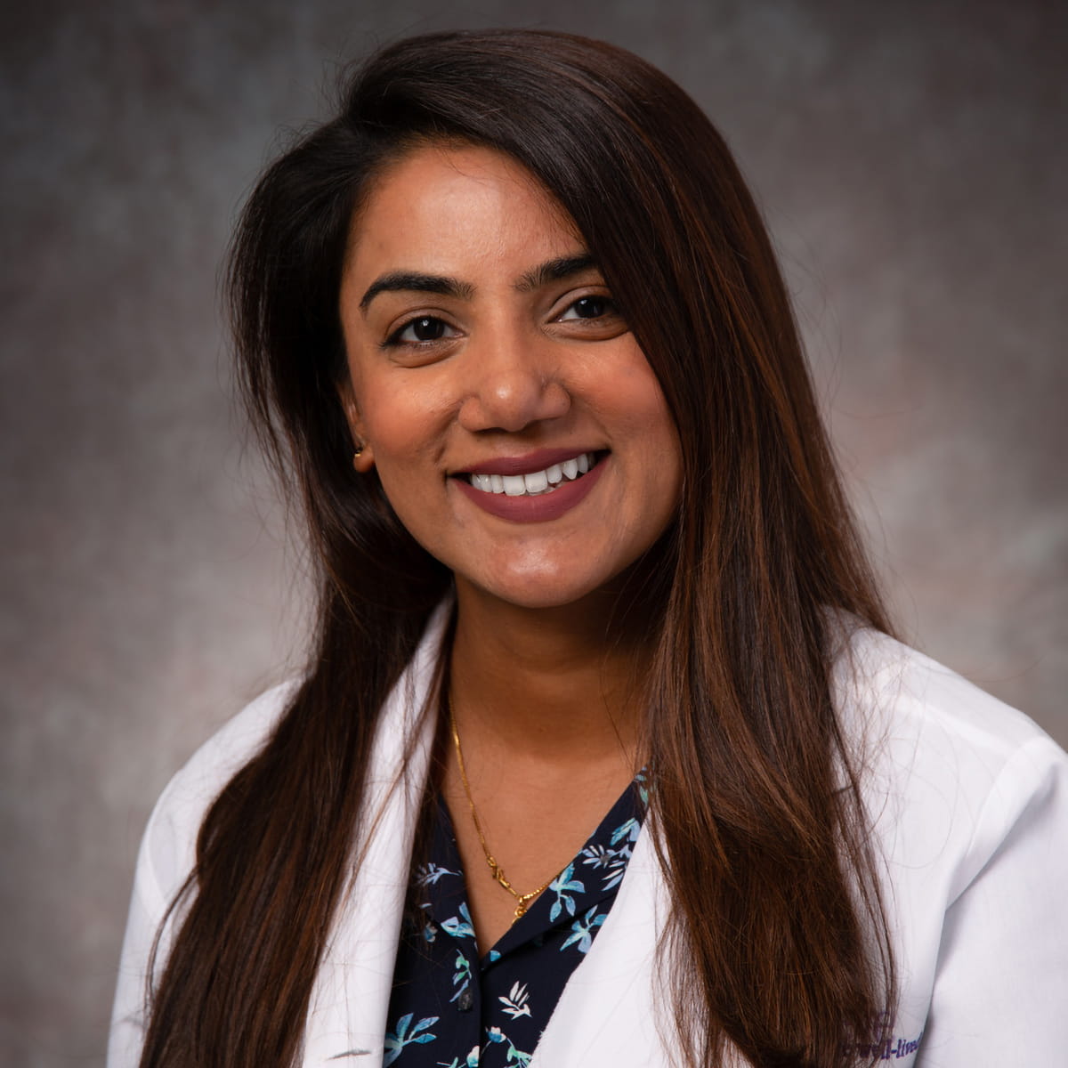 A friendly headshot of Neena Alex, MD