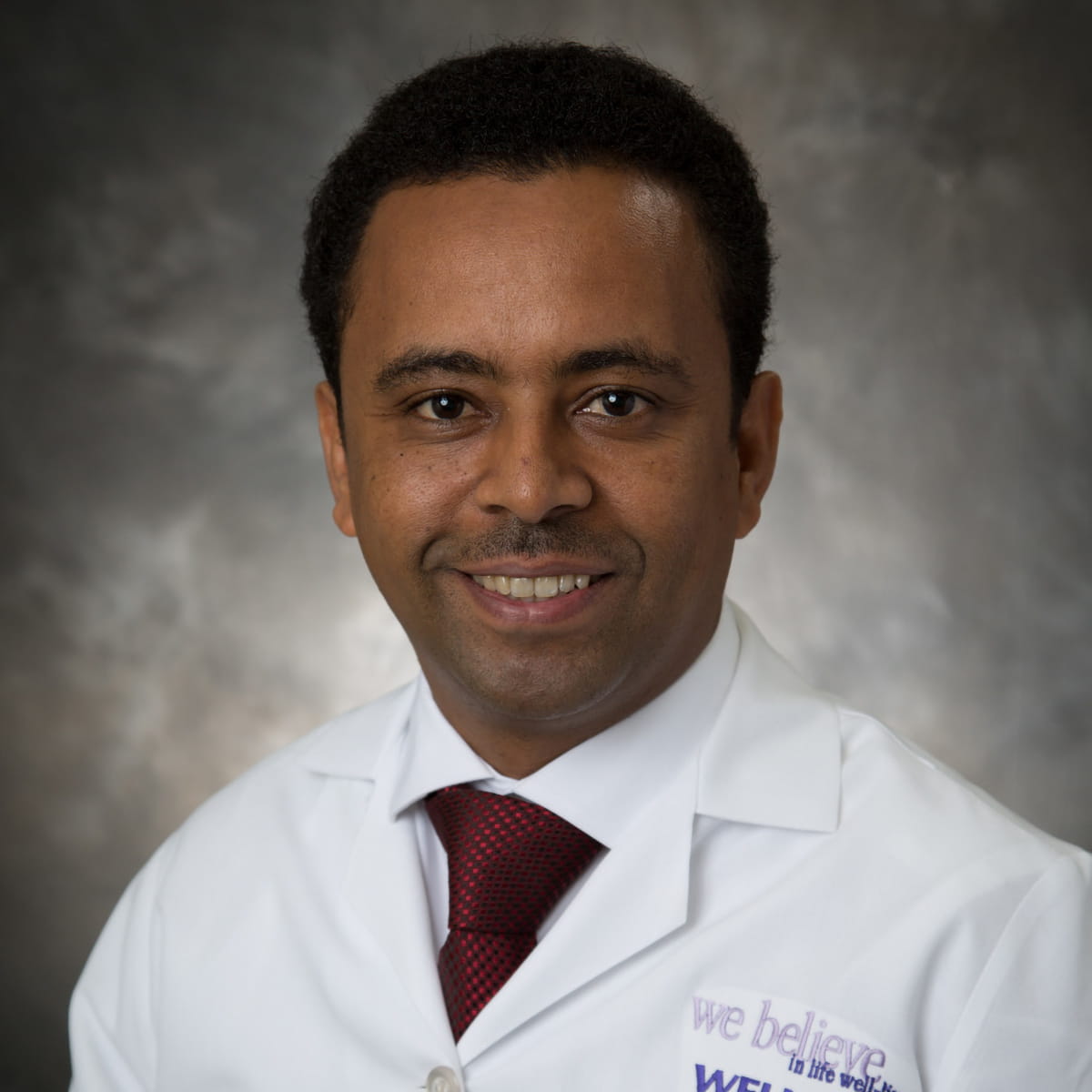 A friendly headshot of Nega Gebremariam, MD