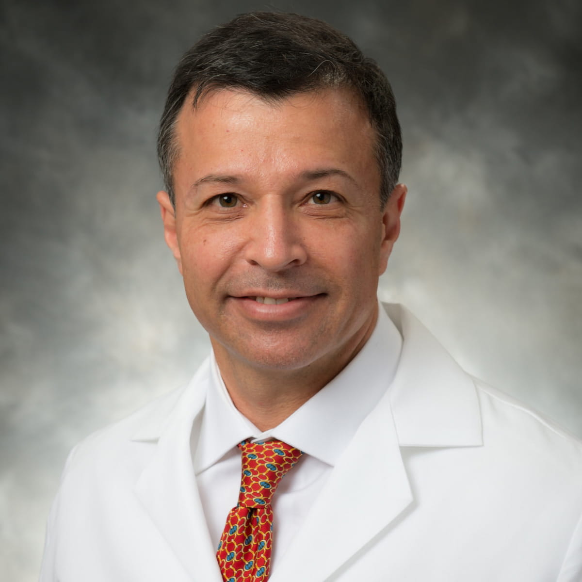 A friendly headshot of Nikolas Symbas, MD