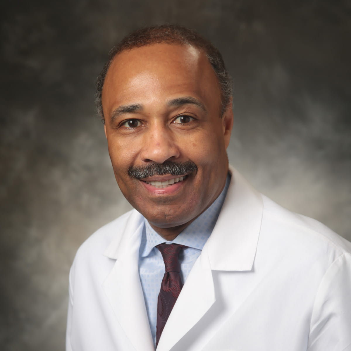 A friendly headshot of Paul Douglass, MD