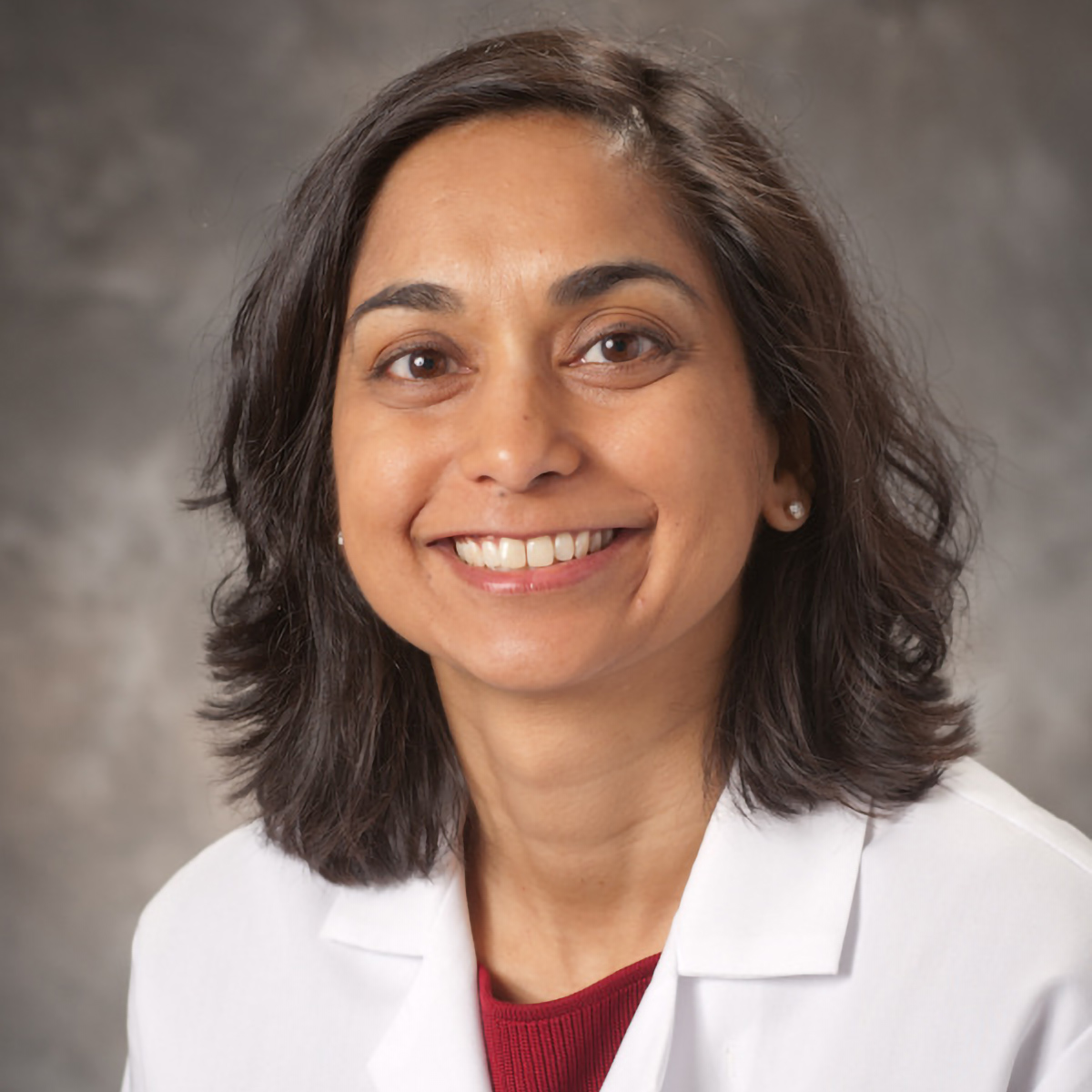 A friendly headshot of Priya Behari, MD