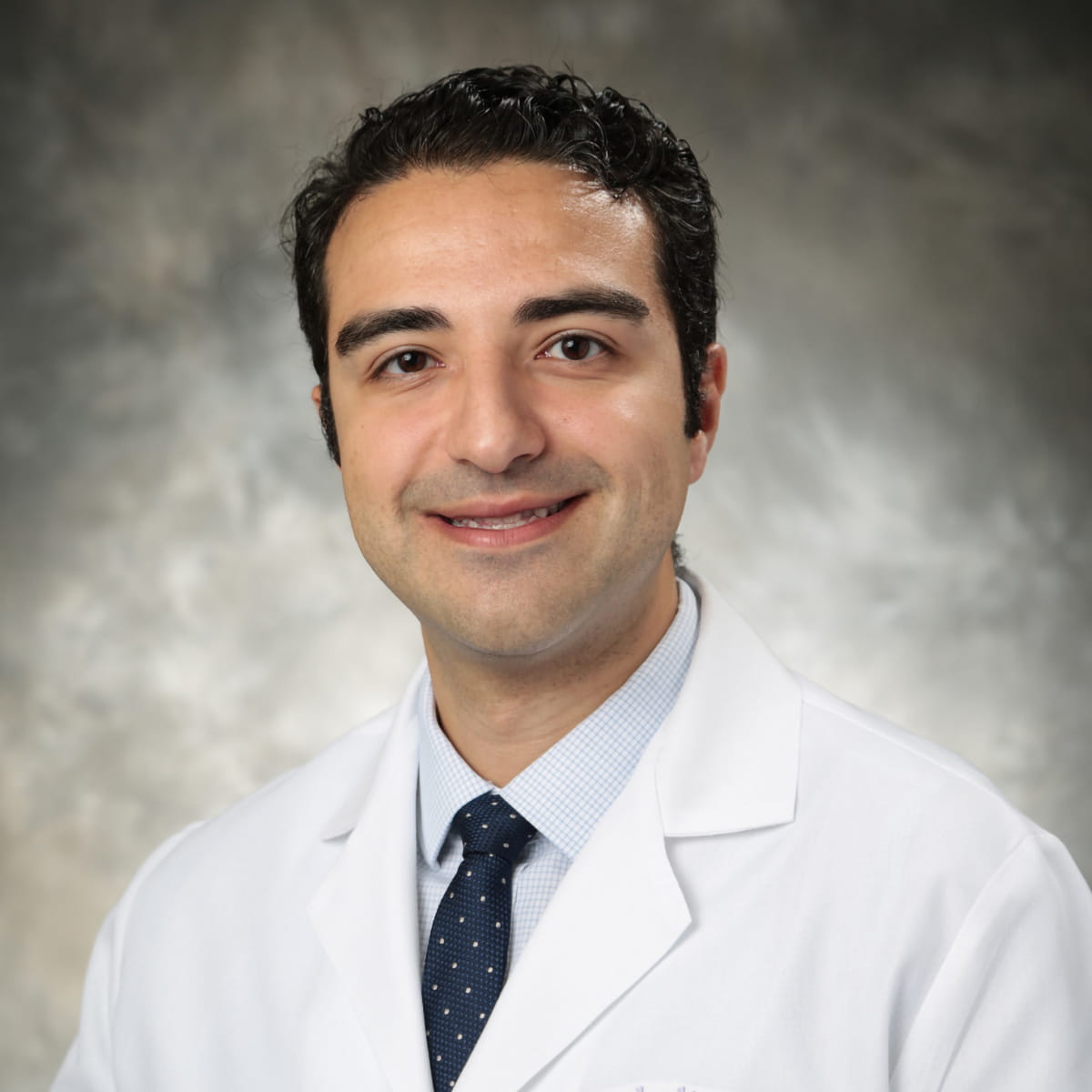 A friendly headshot of Ramin Saghafi, MD